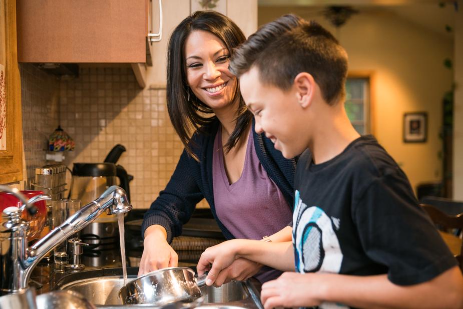 mother-son-enjoying-while-doing-household-work